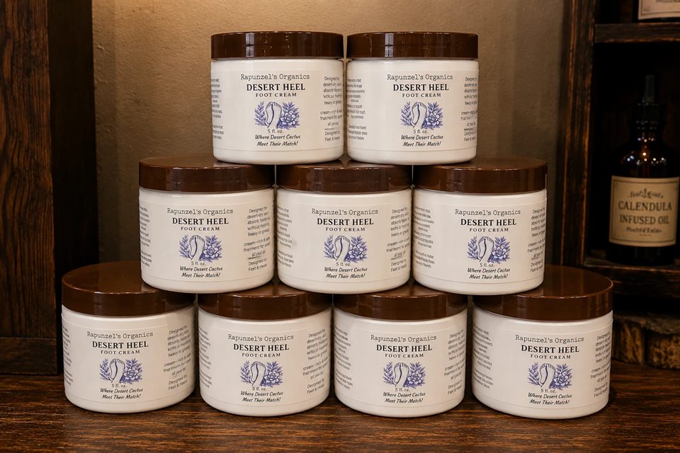 Jars of Desert Heel foot cream stacked in a pyramid